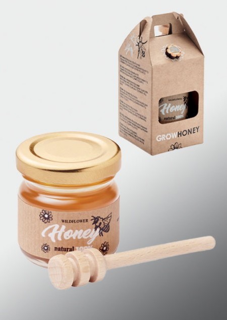 Wildblumen-Honig mit Honiglöffel